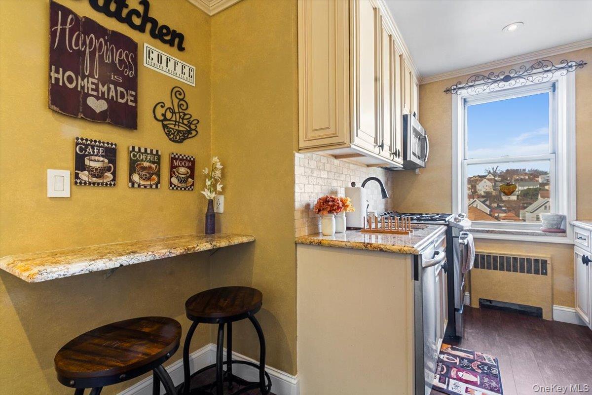 485 Bronx River Road, Unit C62 Yonkers, NY 10704 - Photo 13 of 21 a view of a kitchen with granite countertop a sink and a stove