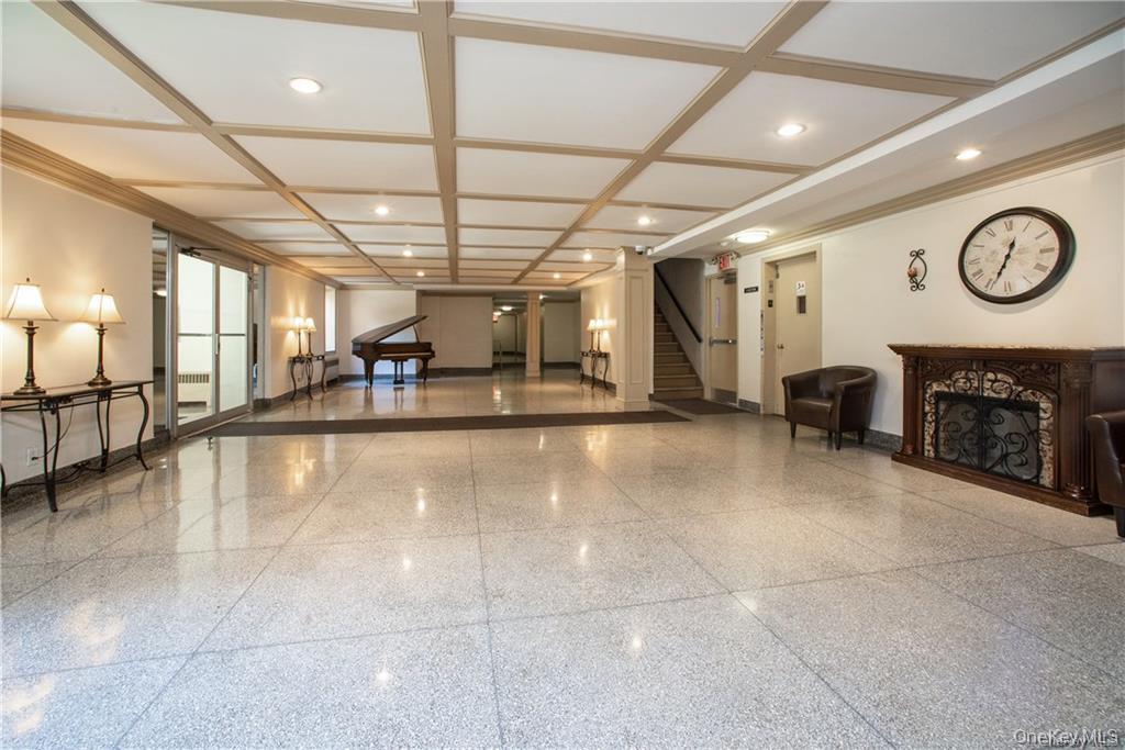 485 Bronx River Road, Unit C62 Yonkers, NY 10704 - Photo 3 of 21 a lobby with furniture and a clock