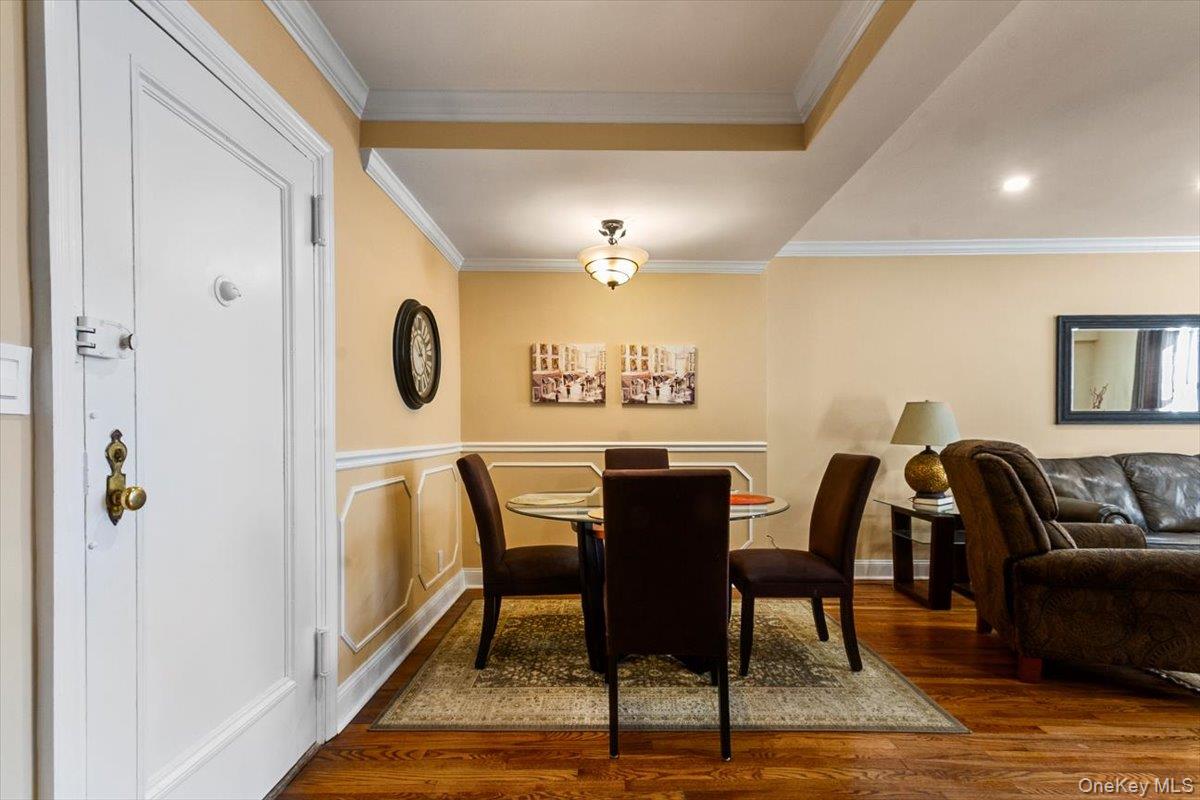 485 Bronx River Road, Unit C62 Yonkers, NY 10704 - Photo 4 of 21 a view of a a dining room with furniture window and wooden floor