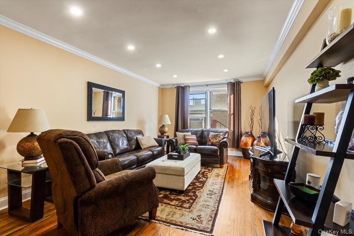 485 Bronx River Road, Unit C62 Yonkers, NY 10704 - Photo 7 of 21 a living room with furniture rug and window