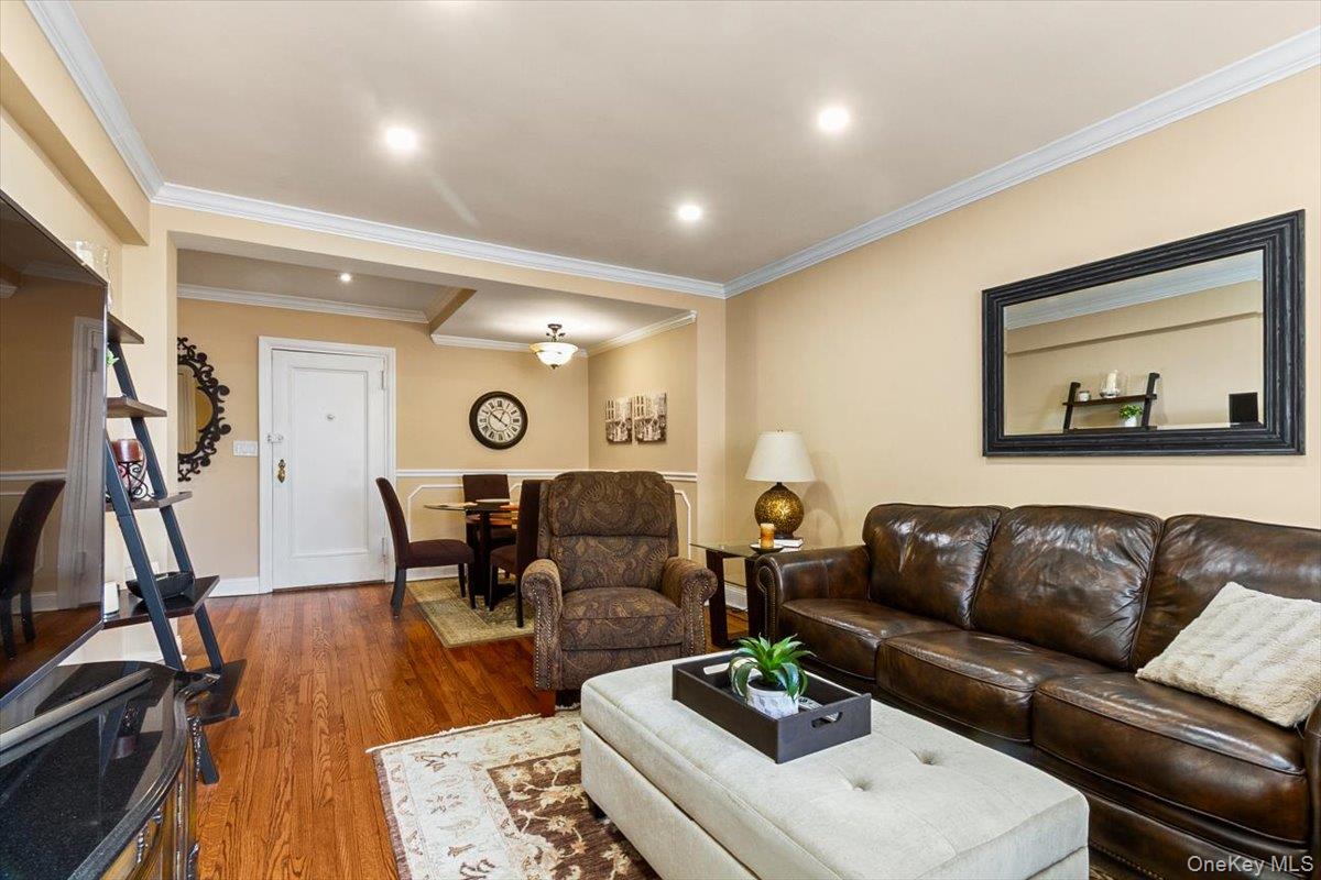 485 Bronx River Road, Unit C62 Yonkers, NY 10704 - Photo 8 of 21 a living room with furniture and wooden floor
