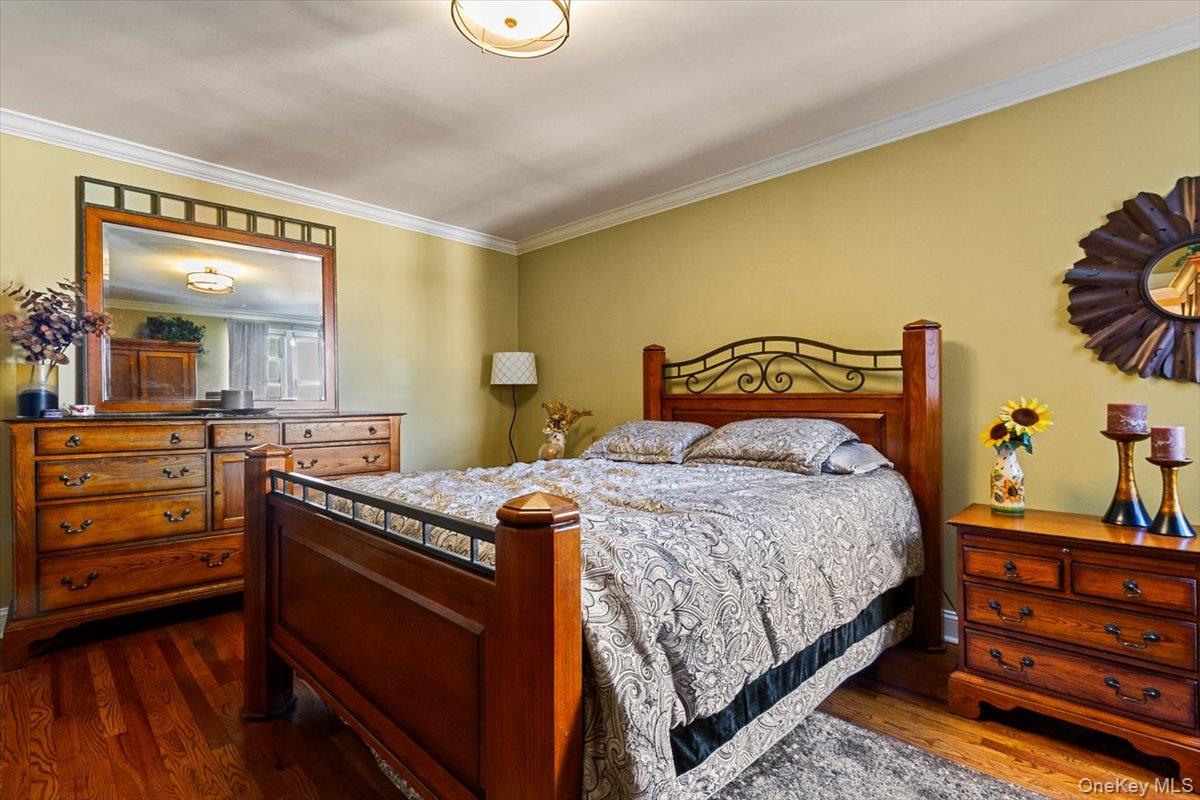 485 Bronx River Road, Unit C62 Yonkers, NY 10704 - Photo 9 of 21 a bedroom with a bed and a dresser in it