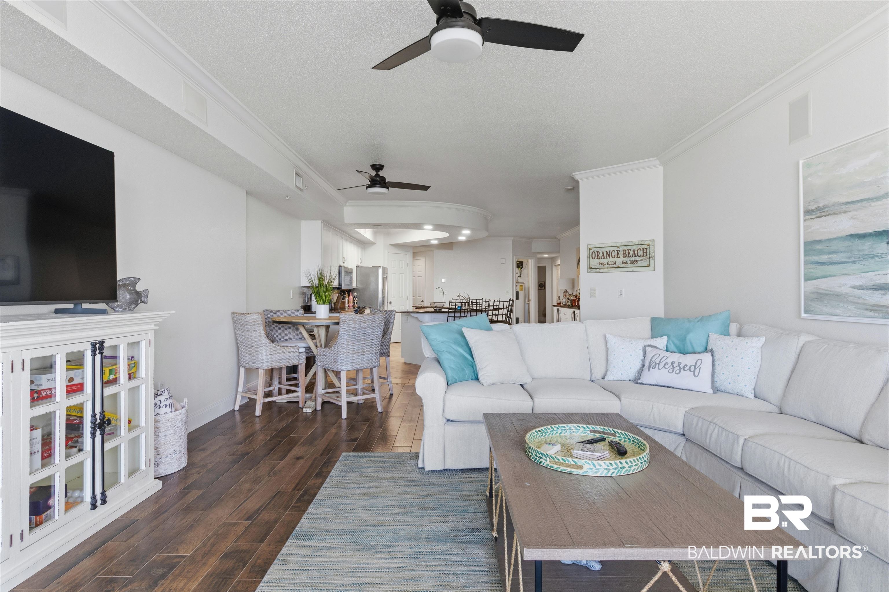 3564 Bayou Road, Unit 203 Orange Beach, AL 36561 - Photo 21 of 53 Open-concept living space featuring wood-finish flooring, recessed lighting, and crown molding