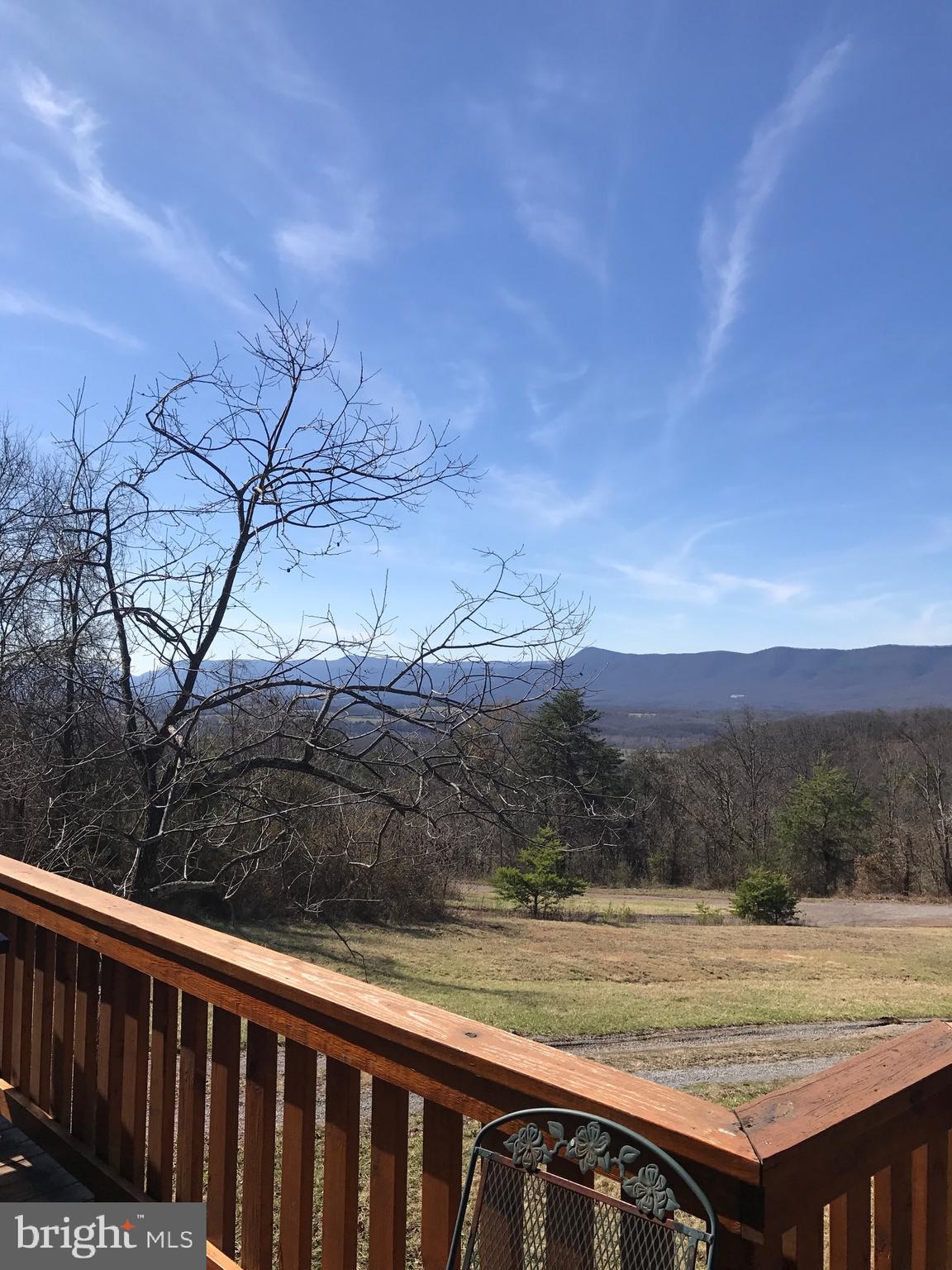 205 Meadow Hill Lane Rileyville, VA 22650 - Photo 11 of 53 a view of a backyard with wooden fence and floor