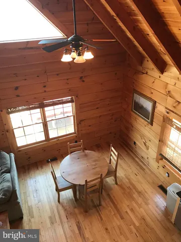 a view of a livingroom with furniture window and wooden floor