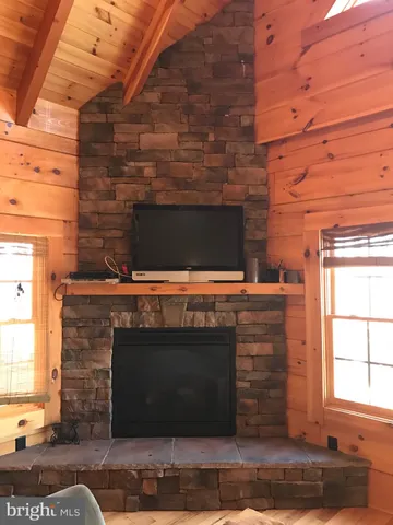 a kitchen with stainless steel appliances granite countertop a refrigerator a stove and a sink