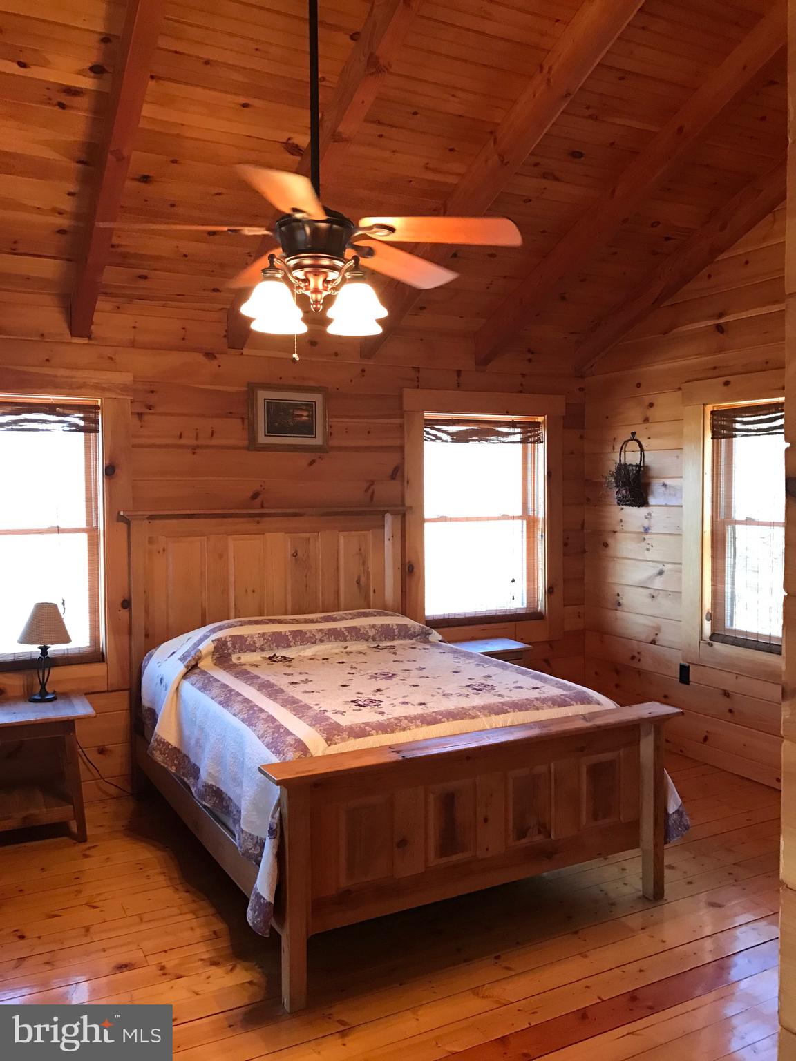 205 Meadow Hill Lane Rileyville, VA 22650 - Photo 29 of 53 a bedroom with a bed and a window