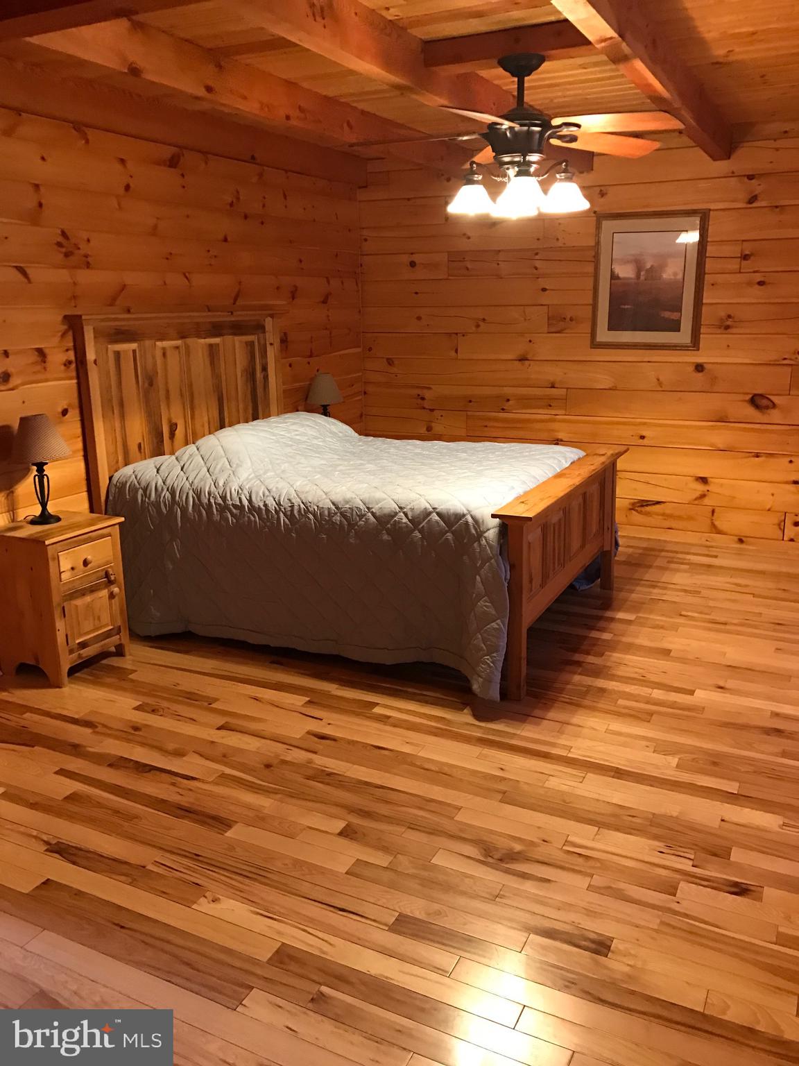 205 Meadow Hill Lane Rileyville, VA 22650 - Photo 33 of 53 a bedroom with a bed and a view of balcony