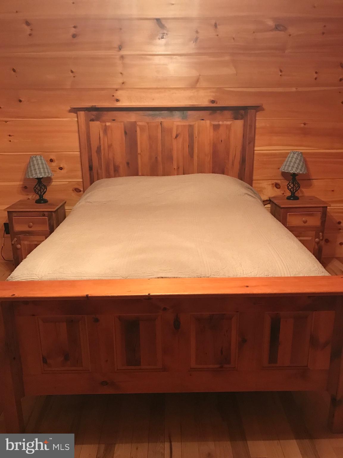 205 Meadow Hill Lane Rileyville, VA 22650 - Photo 48 of 53 a bedroom with a bed