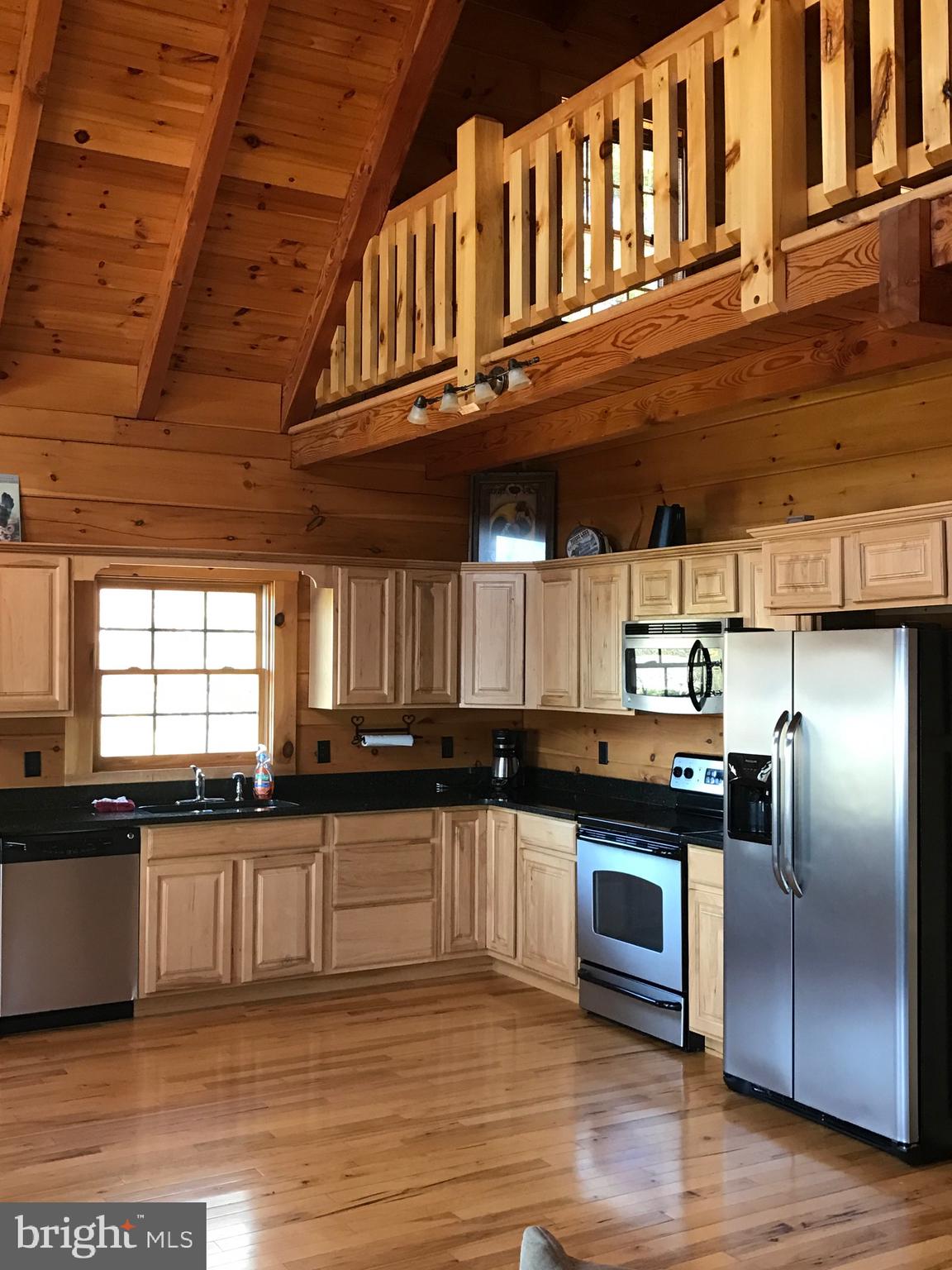 205 Meadow Hill Lane Rileyville, VA 22650 - Photo 49 of 53 a kitchen with stainless steel appliances granite countertop a stove and a sink