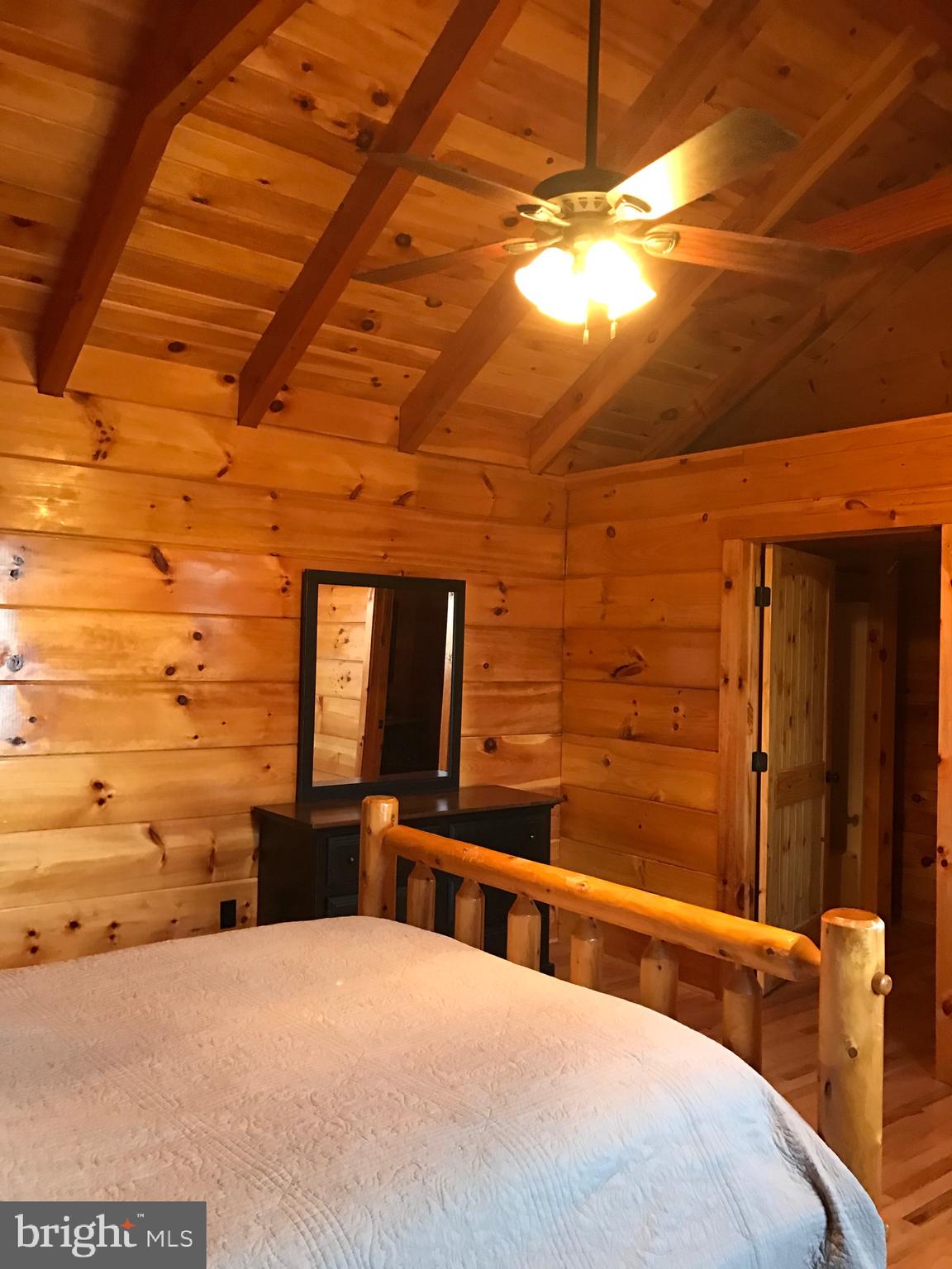 205 Meadow Hill Lane Rileyville, VA 22650 - Photo 6 of 53 a bedroom with a bed and a dresser