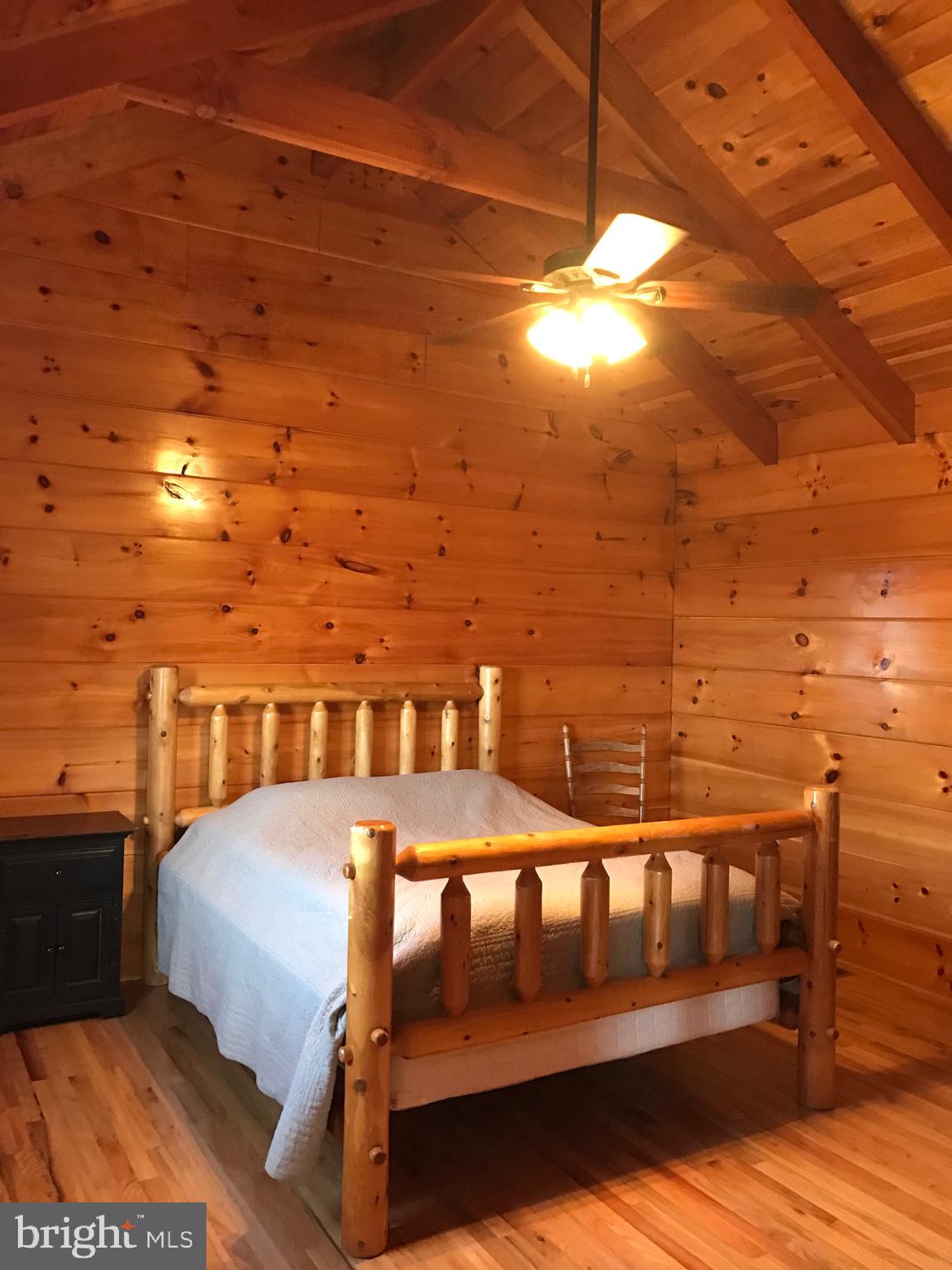 205 Meadow Hill Lane Rileyville, VA 22650 - Photo 7 of 53 a view of a balcony with furniture