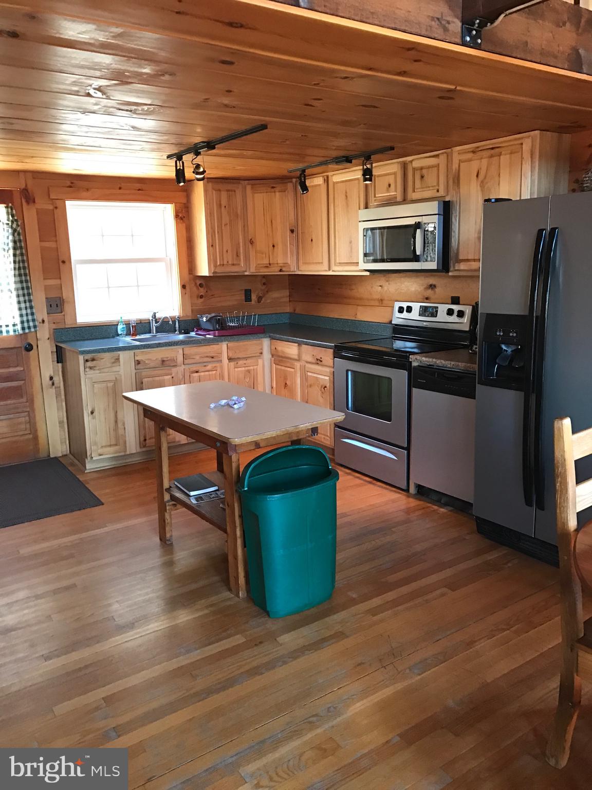 205 Meadow Hill Lane Rileyville, VA 22650 - Photo 9 of 53 a kitchen with stainless steel appliances granite countertop a stove a sink and a microwave