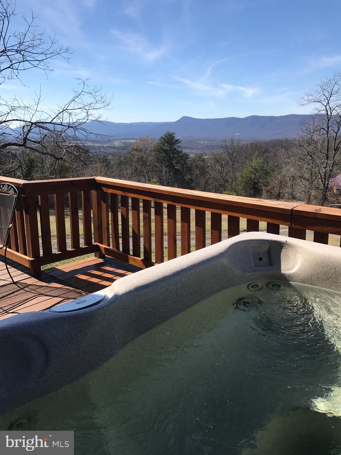 205 Meadow Hill Lane Rileyville, VA 22650 - Photo 10 of 53 a balcony with furniture and city view
