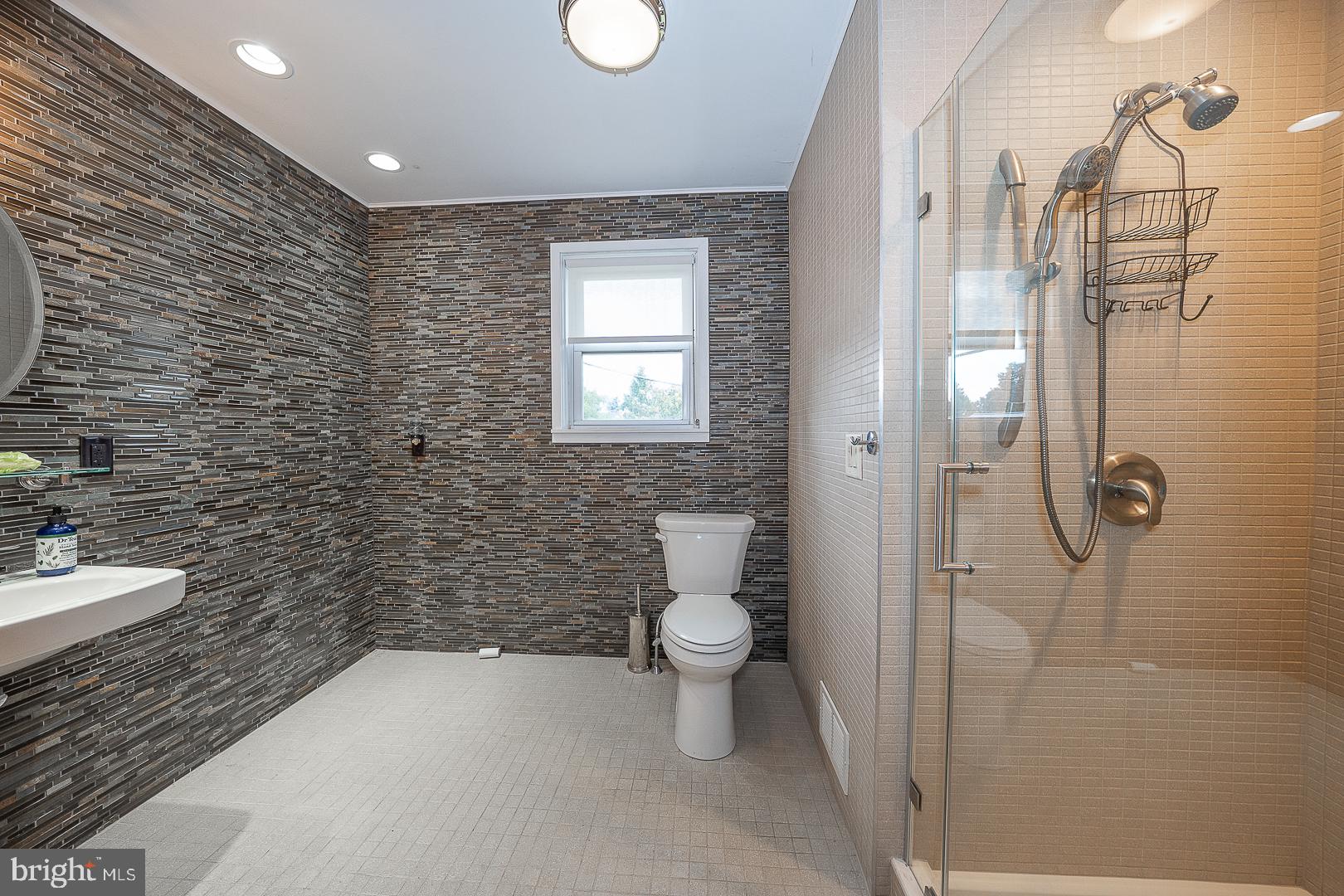 20 Fairview Road Swarthmore, PA 19081 - Photo 35 of 57 a bathroom with a toilet sink and shower