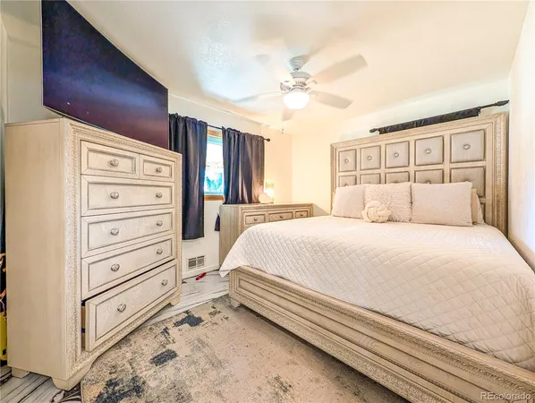 a bedroom with a bed and a dresser