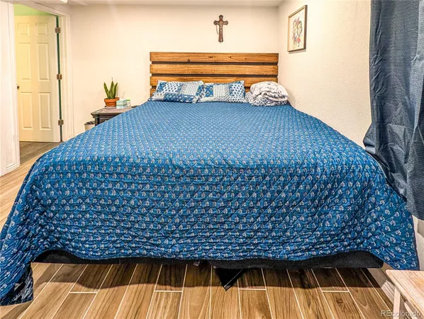 a room with a baby crib and a sink