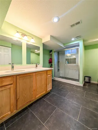 a kitchen with stainless steel appliances kitchen island granite countertop a refrigerator and microwave