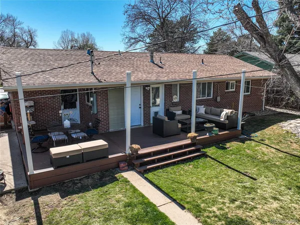 a view of a house with backyard tub and wooden fence