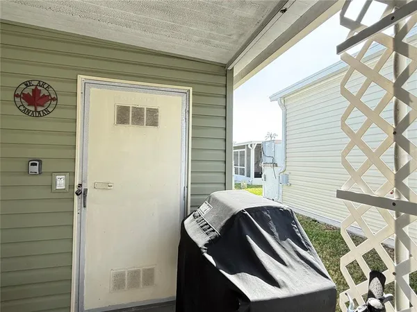 a view of a balcony with furniture