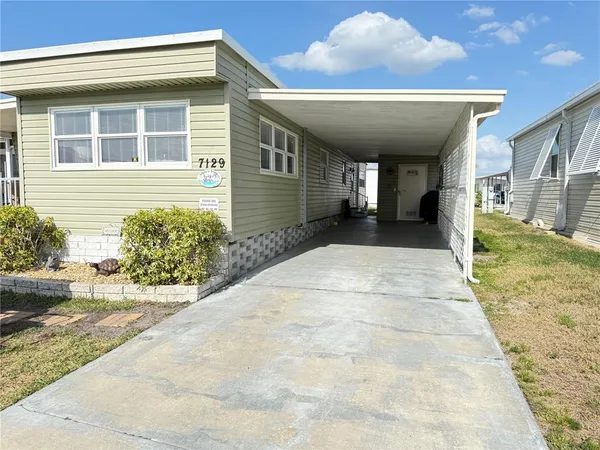 a view of a patio with a yard