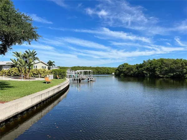 a view of a lake with a big yard