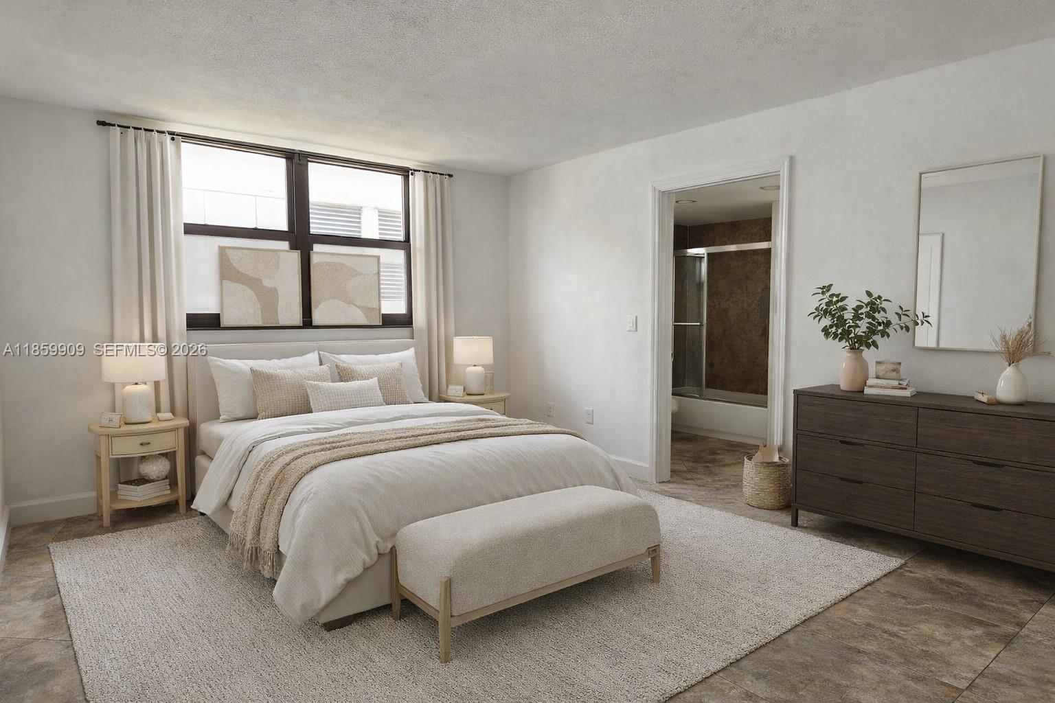 1621 Collins Avenue, Unit 404 Miami Beach, FL 33139 - Photo 11 of 26 a bedroom with a bed and a window