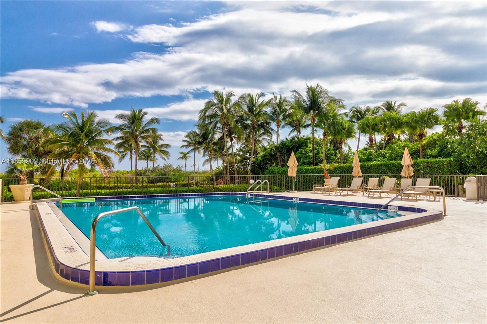 1621 Collins Avenue, Unit 404 Miami Beach, FL 33139 - Photo 17 of 26 a view of swimming pool with outdoor seating and garden