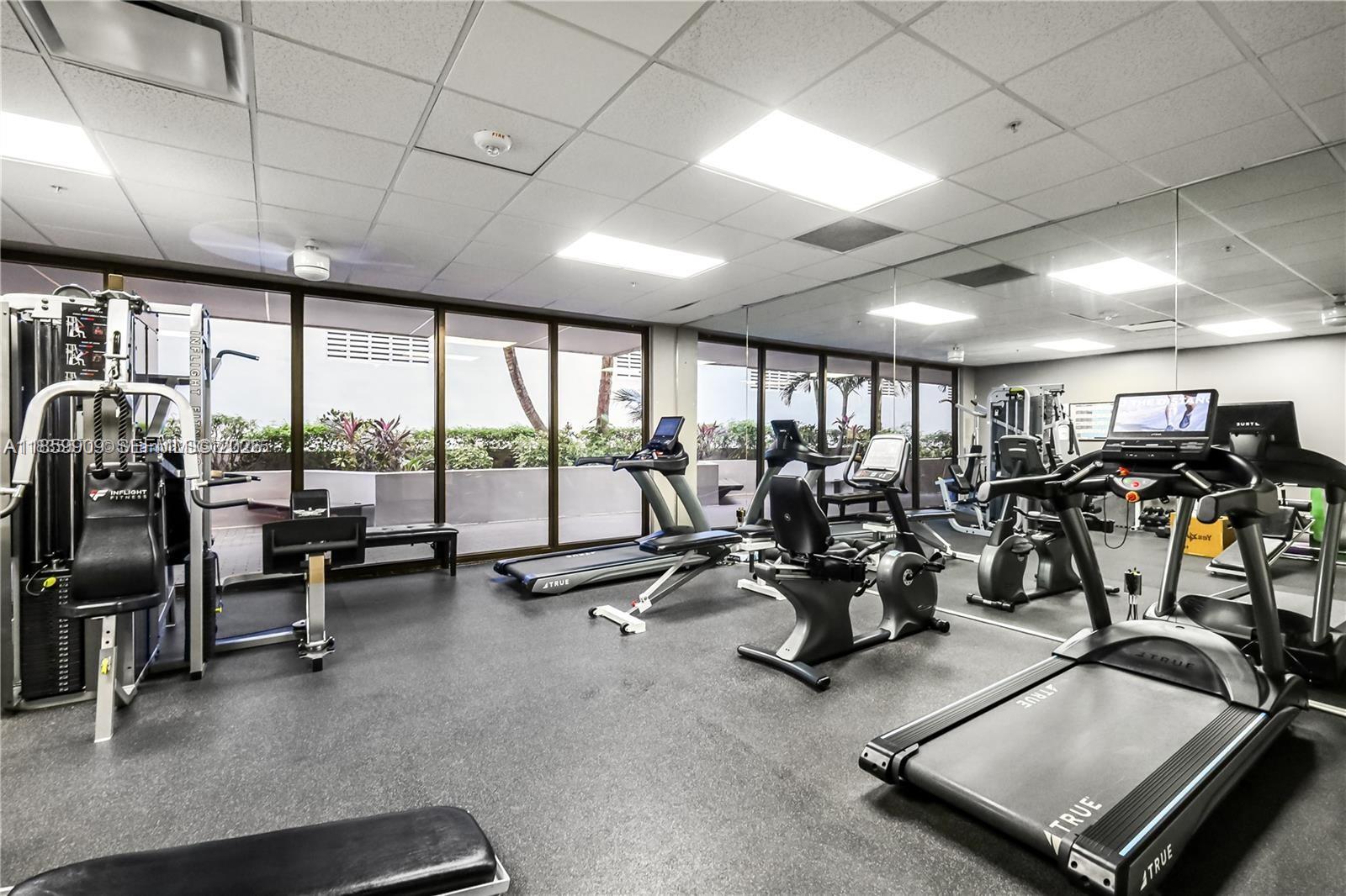 1621 Collins Avenue, Unit 404 Miami Beach, FL 33139 - Photo 19 of 26 a view of a room with gym equipment