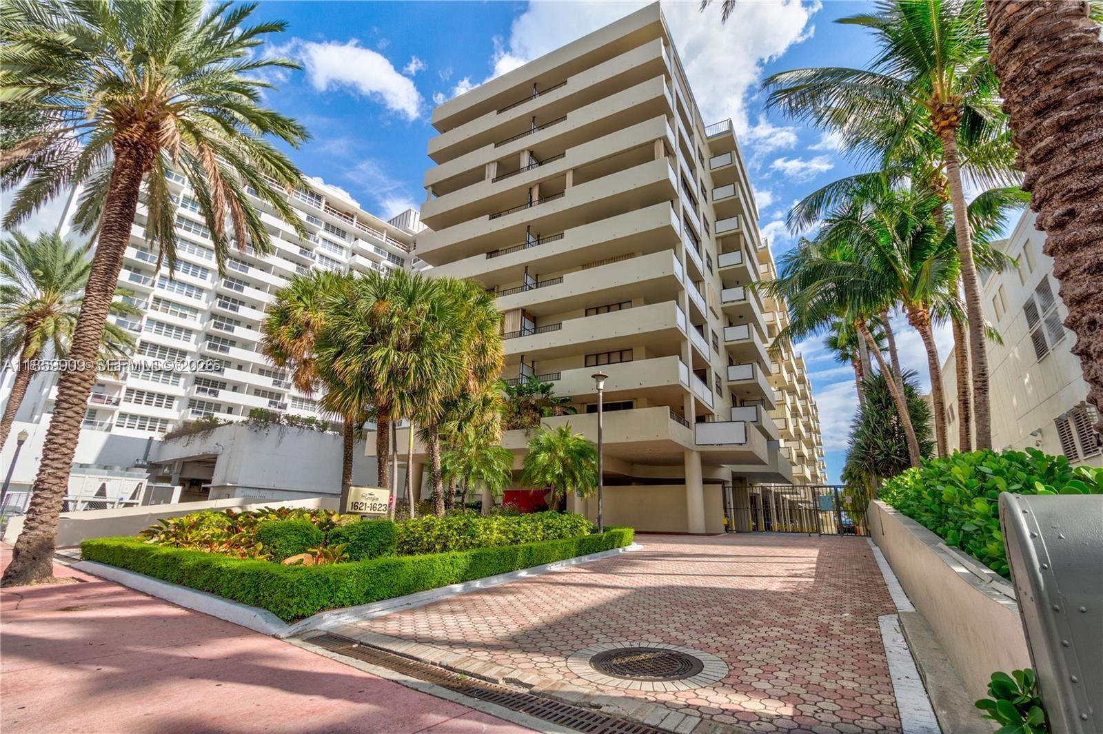 1621 Collins Avenue, Unit 404 Miami Beach, FL 33139 - Photo 2 of 26 a front view of a multi story building with yard