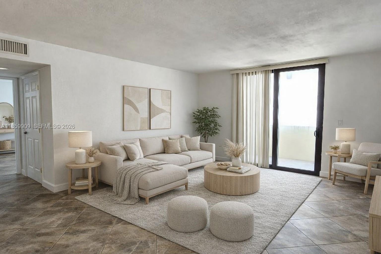 1621 Collins Avenue, Unit 404 Miami Beach, FL 33139 - Photo 6 of 26 a living room with furniture and a potted plant