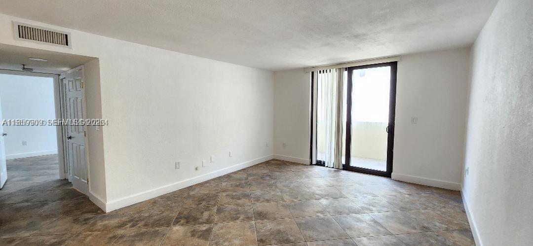 1621 Collins Avenue, Unit 404 Miami Beach, FL 33139 - Photo 7 of 26 an empty room with windows