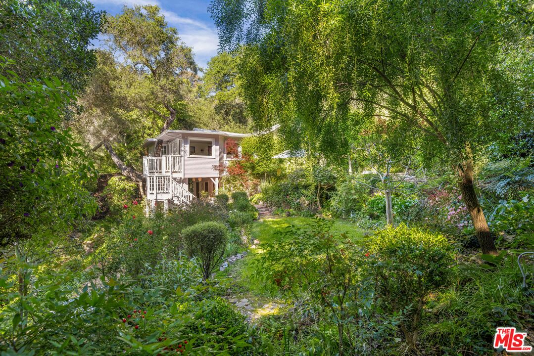 21714 Encina Road Topanga, CA 90290 - Photo 1 of 45 a view of a house with a yard