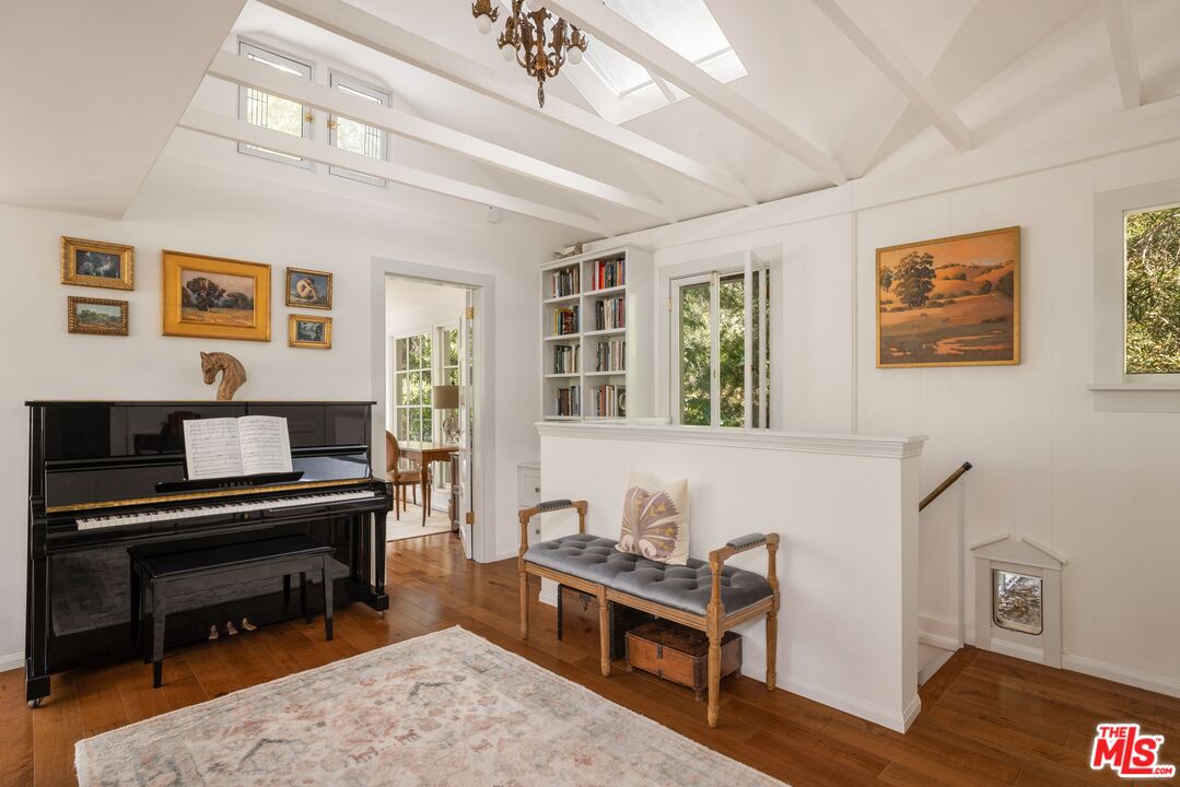 21714 Encina Road Topanga, CA 90290 - Photo 12 of 45 a living room with furniture and a piano