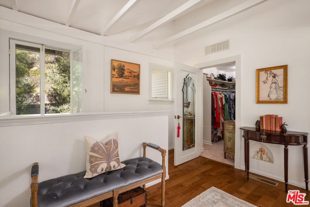 21714 Encina Road Topanga, CA 90290 - Photo 17 of 45 a view of a workspace with furniture and a window