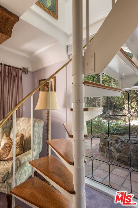 21714 Encina Road Topanga, CA 90290 - Photo 18 of 45 a view of staircase with a rug