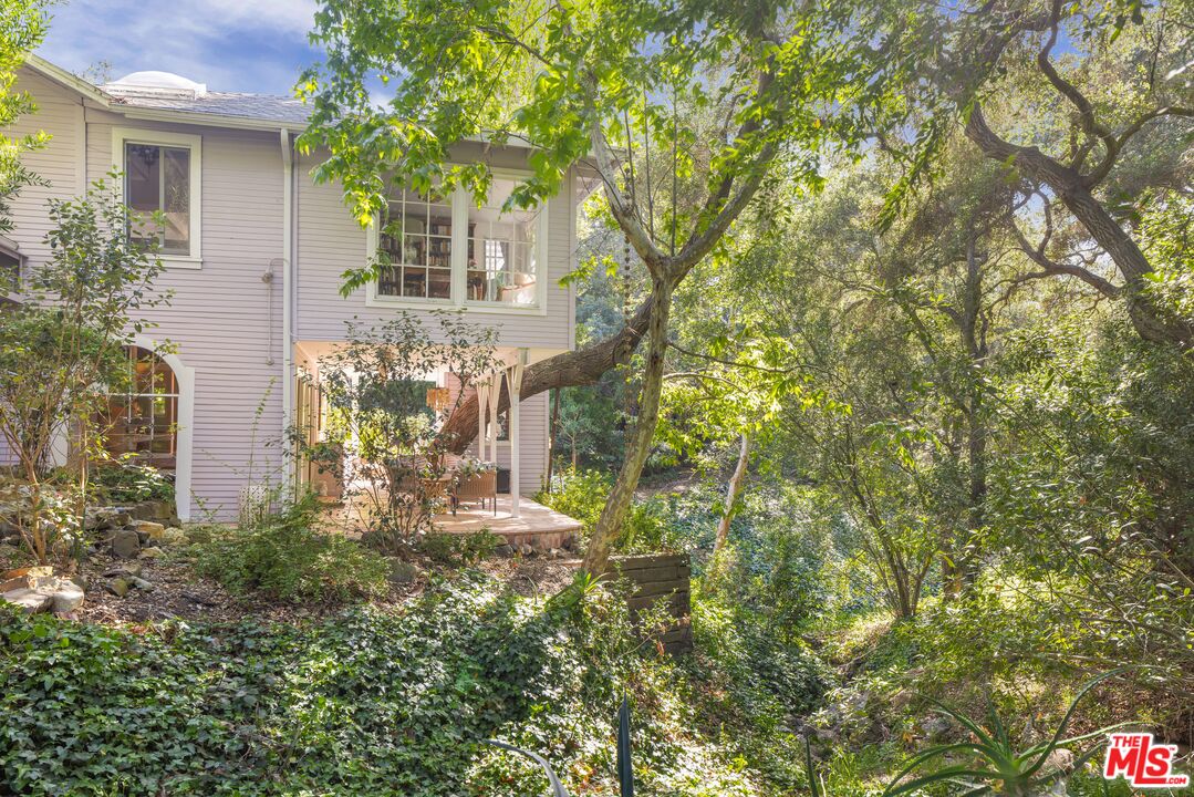 21714 Encina Road Topanga, CA 90290 - Photo 25 of 45 a view of a house with a tree