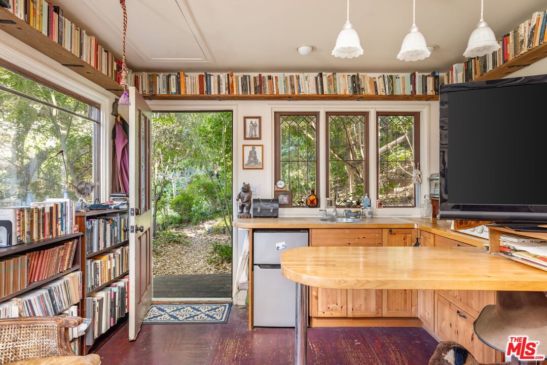 21714 Encina Road Topanga, CA 90290 - Photo 31 of 45 a room with table chairs and a large window