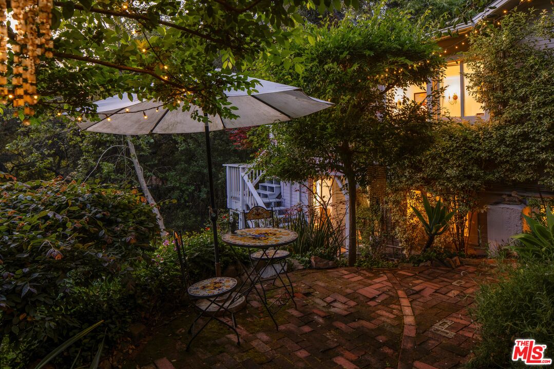 21714 Encina Road Topanga, CA 90290 - Photo 38 of 45 a view of a chairs and table in backyard