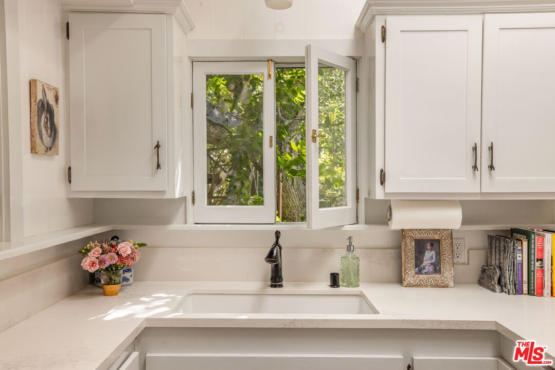 21714 Encina Road Topanga, CA 90290 - Photo 7 of 45 a kitchen with a sink and a window