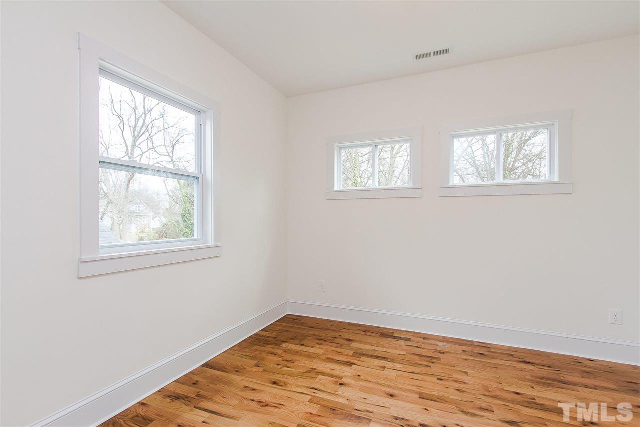 1113 South Person Street Raleigh, NC 27601 - Photo 14 of 18 a view of empty room with wooden floor and fan