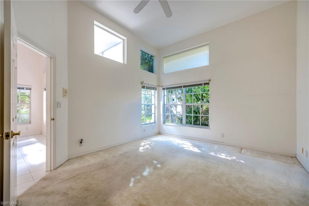172 Napa Ridge Way Naples, FL 34119 - Photo 12 of 17 a view of an empty room with a window