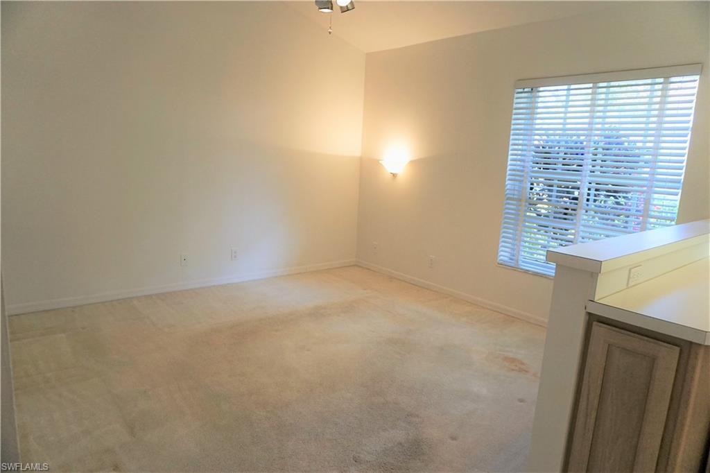 172 Napa Ridge Way Naples, FL 34119 - Photo 16 of 17 a view of an empty room with a window