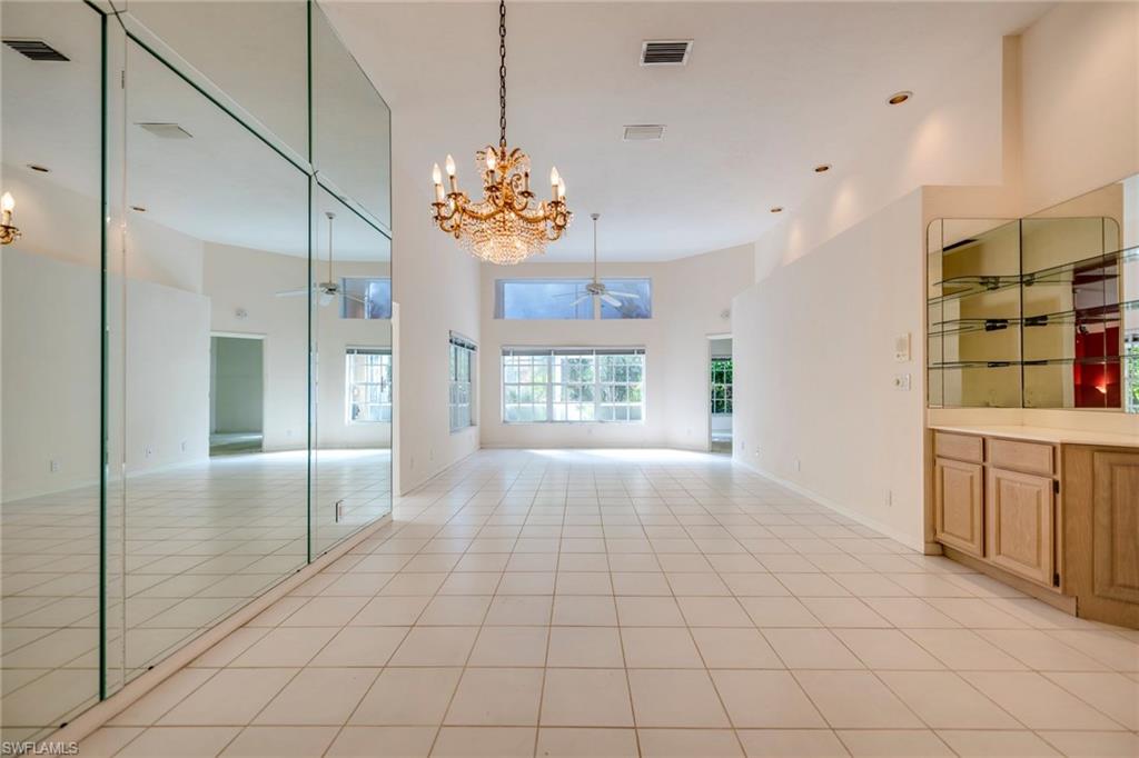 172 Napa Ridge Way Naples, FL 34119 - Photo 4 of 17 a view of an empty room and window