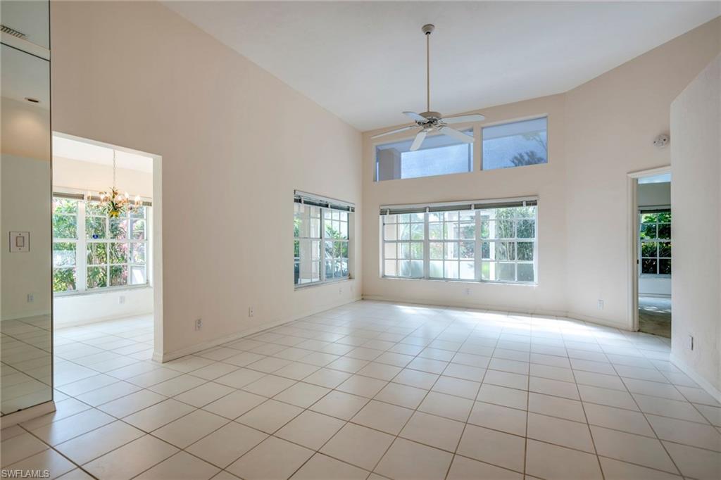 172 Napa Ridge Way Naples, FL 34119 - Photo 5 of 17 a view of an empty room with a window