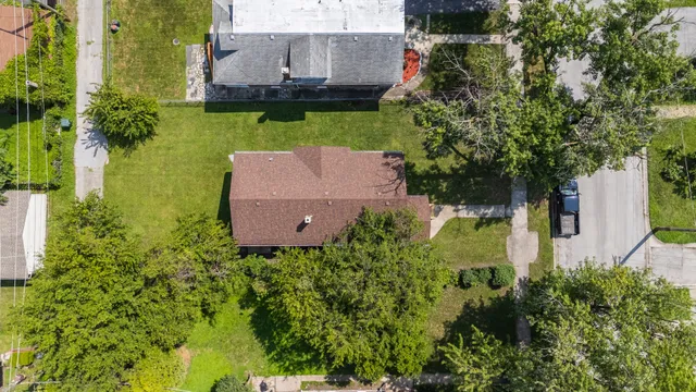 an aerial view of a house with a garden