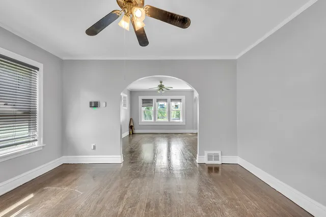 wooden floor in an empty room with a window