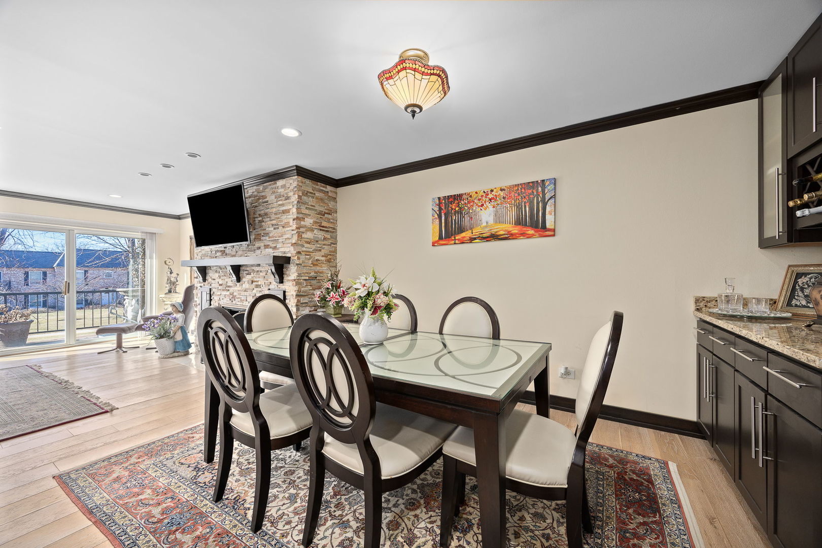 140 Carriage Way Drive, Unit C218 Burr Ridge, IL 60527 - Photo 13 of 33 a view of a dining room with furniture and chandelier