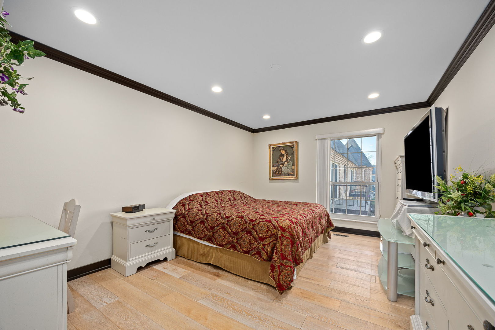 140 Carriage Way Drive, Unit C218 Burr Ridge, IL 60527 - Photo 18 of 33 a spacious bedroom with a bed and a view of bedroom