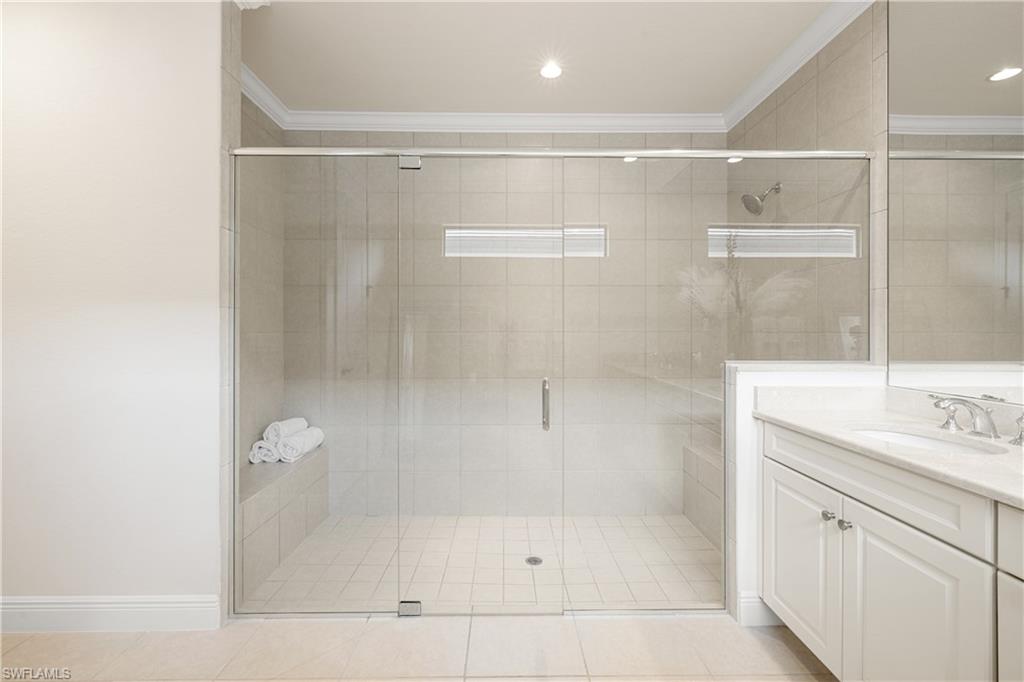 10137 Florence Circle Naples, FL 34119 - Photo 19 of 42 a bathroom with a shower and a sink